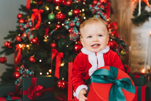 A smiling child receiving a gift at a charity distribution.