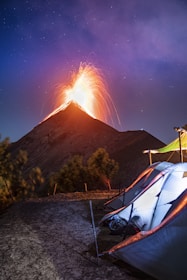 white tent on brown field during night time