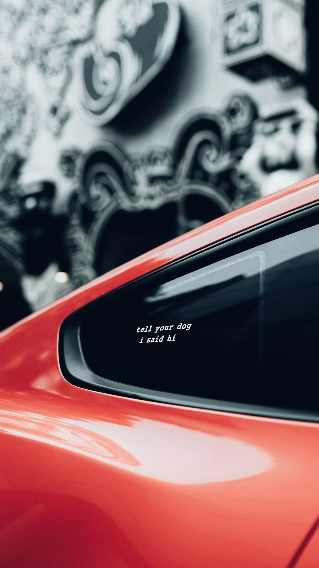 red car with white and black graffiti