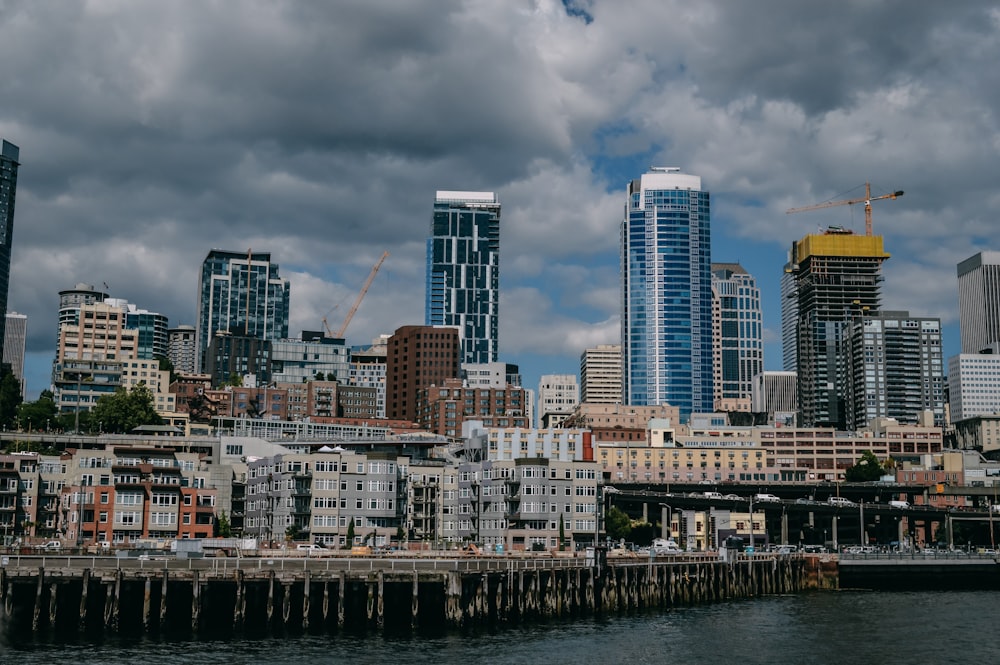 city skyline under gray cloudy sky during daytime