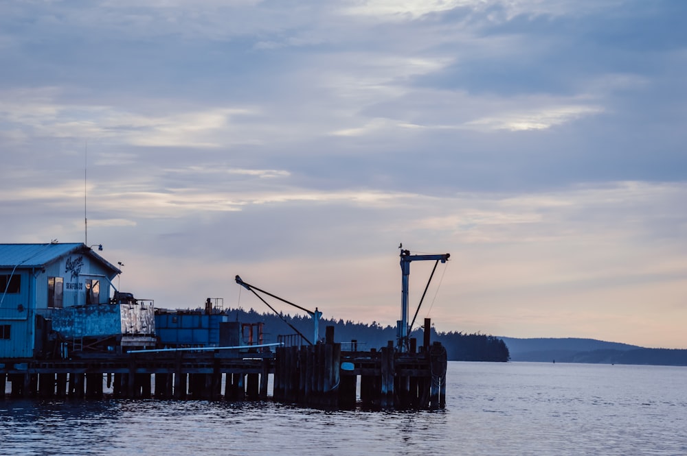 blue and red cargo ship on sea during daytime