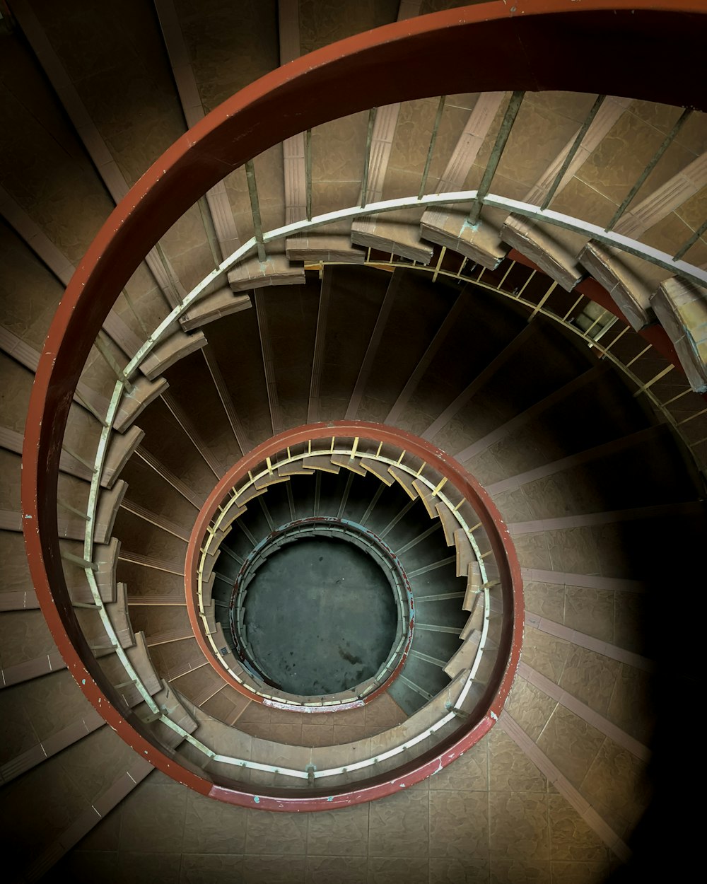 spiral staircase with white metal railings