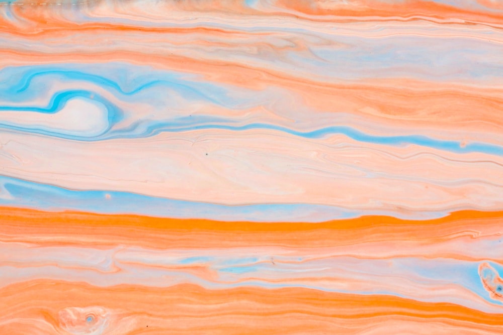 an abstract painting of orange, blue, and yellow colors