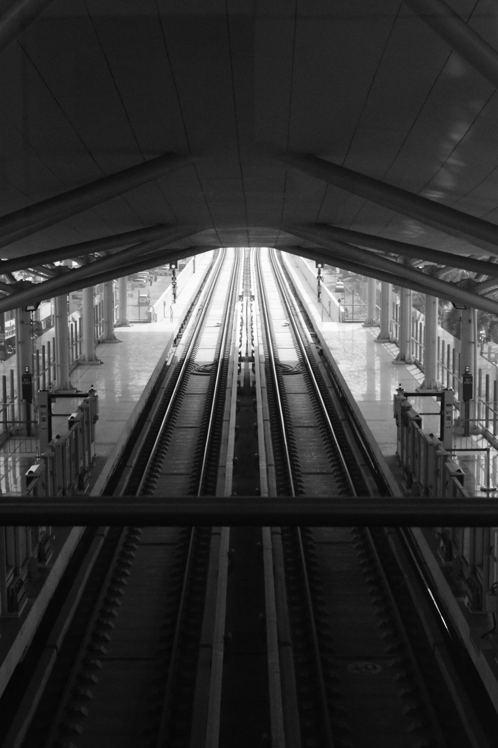 a black and white photo of a train station