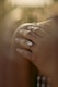 person wearing silver diamond ring