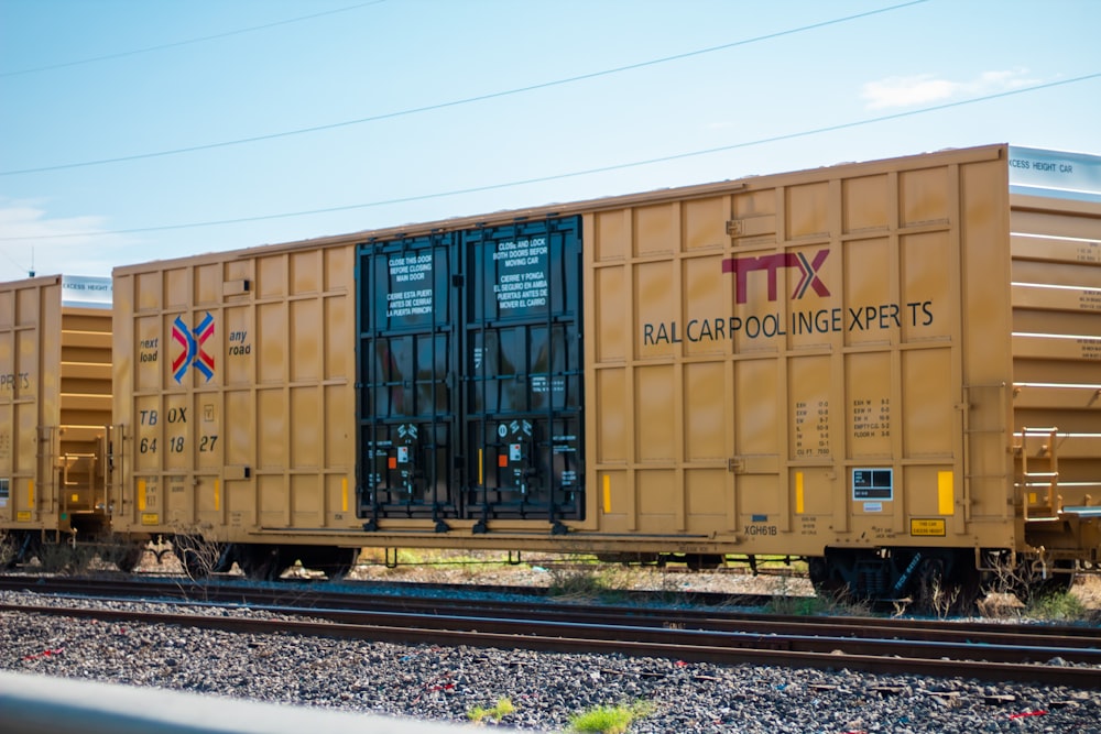 brown and black train on rail tracks