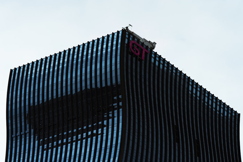 blue and black building under white sky during daytime