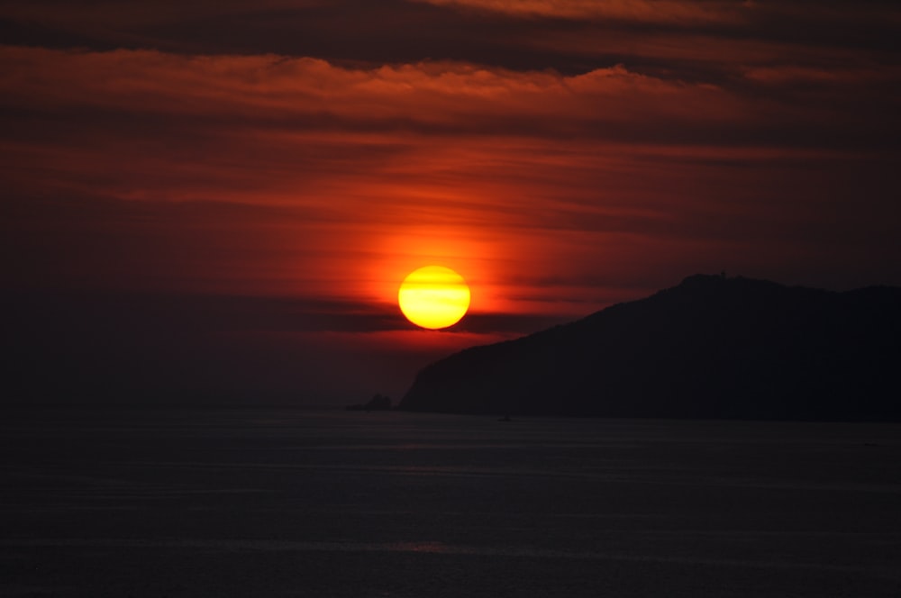 silhouette of mountain during sunset