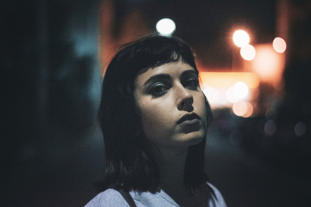 woman in white and black shirt