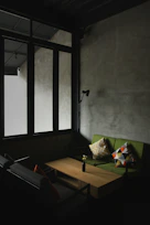 Chic living room with minimalist furniture and warm lighting in a Balakong homestay.