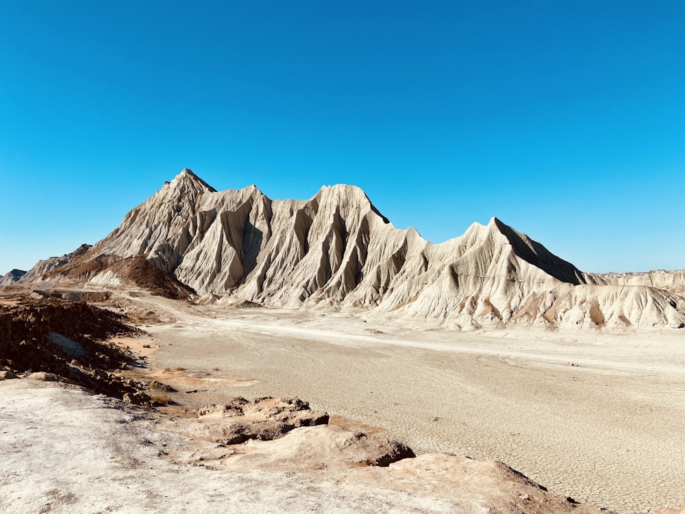 gray rocky mountain under blue sky during daytime