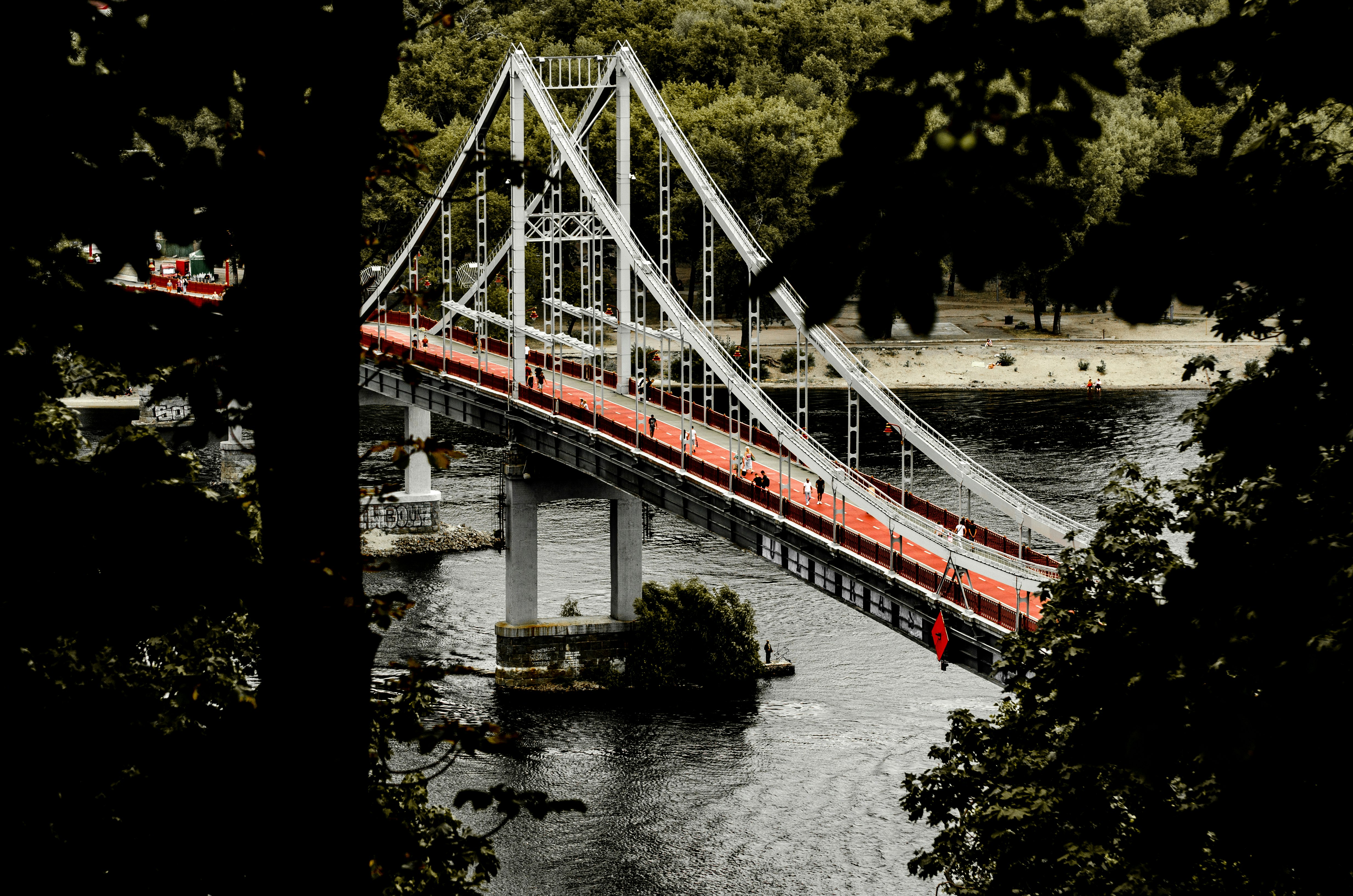 white and red bridge over river