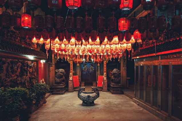 A serene setting featuring traditional Chinese cultural artifacts like prayer beads and incense.