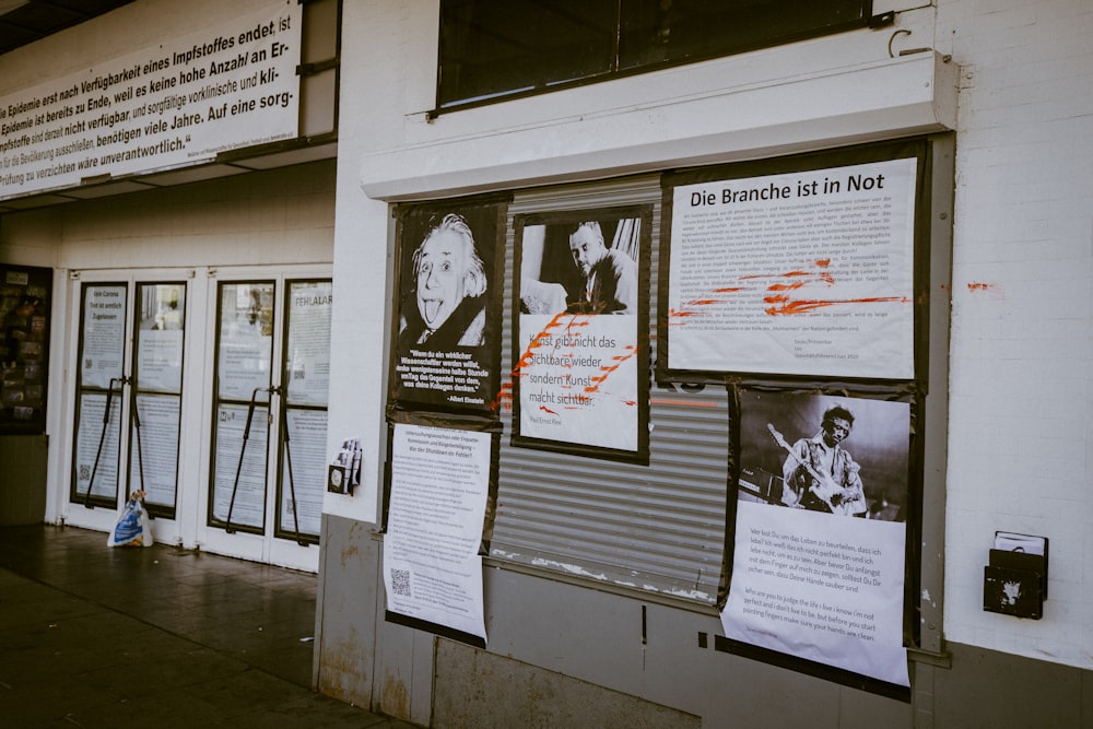 grayscale photo of man and woman on wall