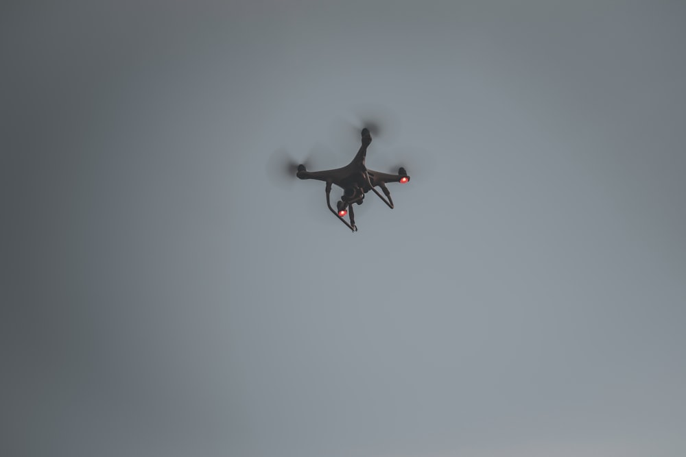 black and red drone flying