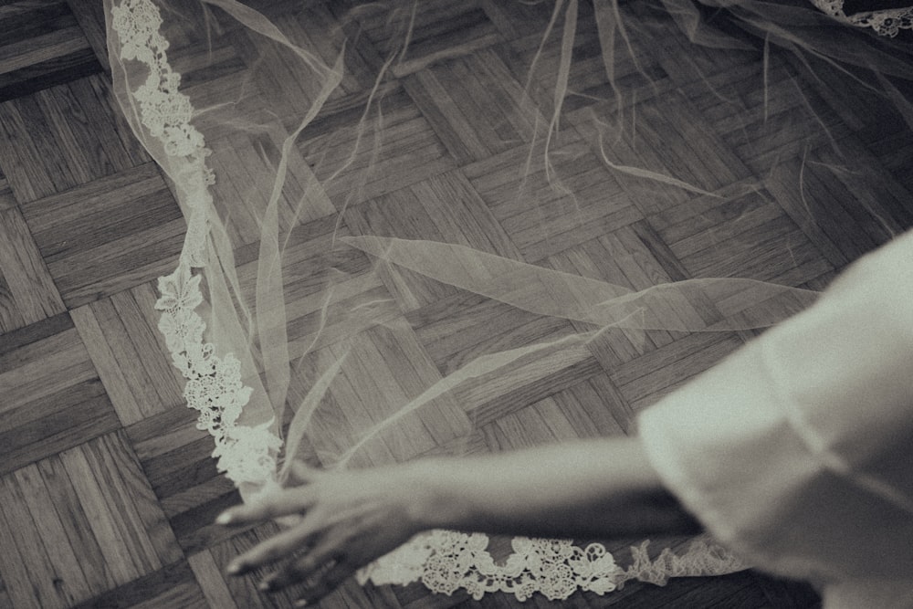 person in white and brown floral dress