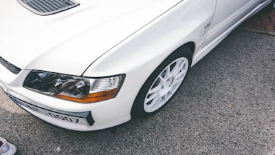 white car on gray asphalt road mitsubishi google meet background