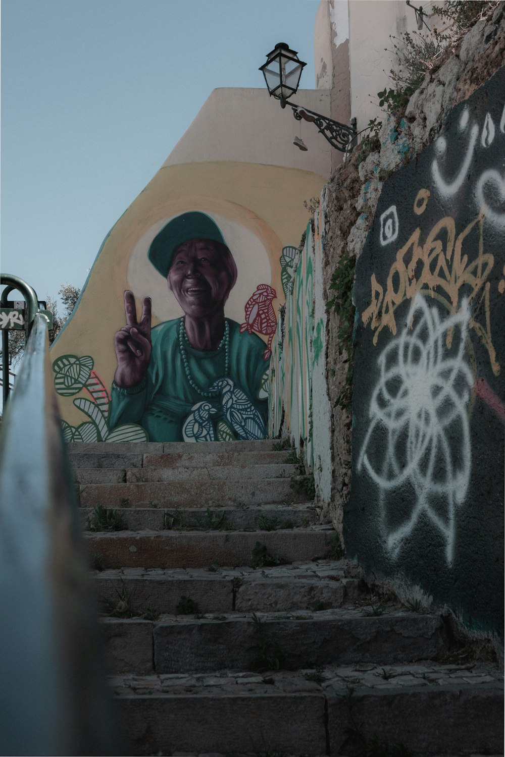 man in green long sleeve shirt sitting on stairs