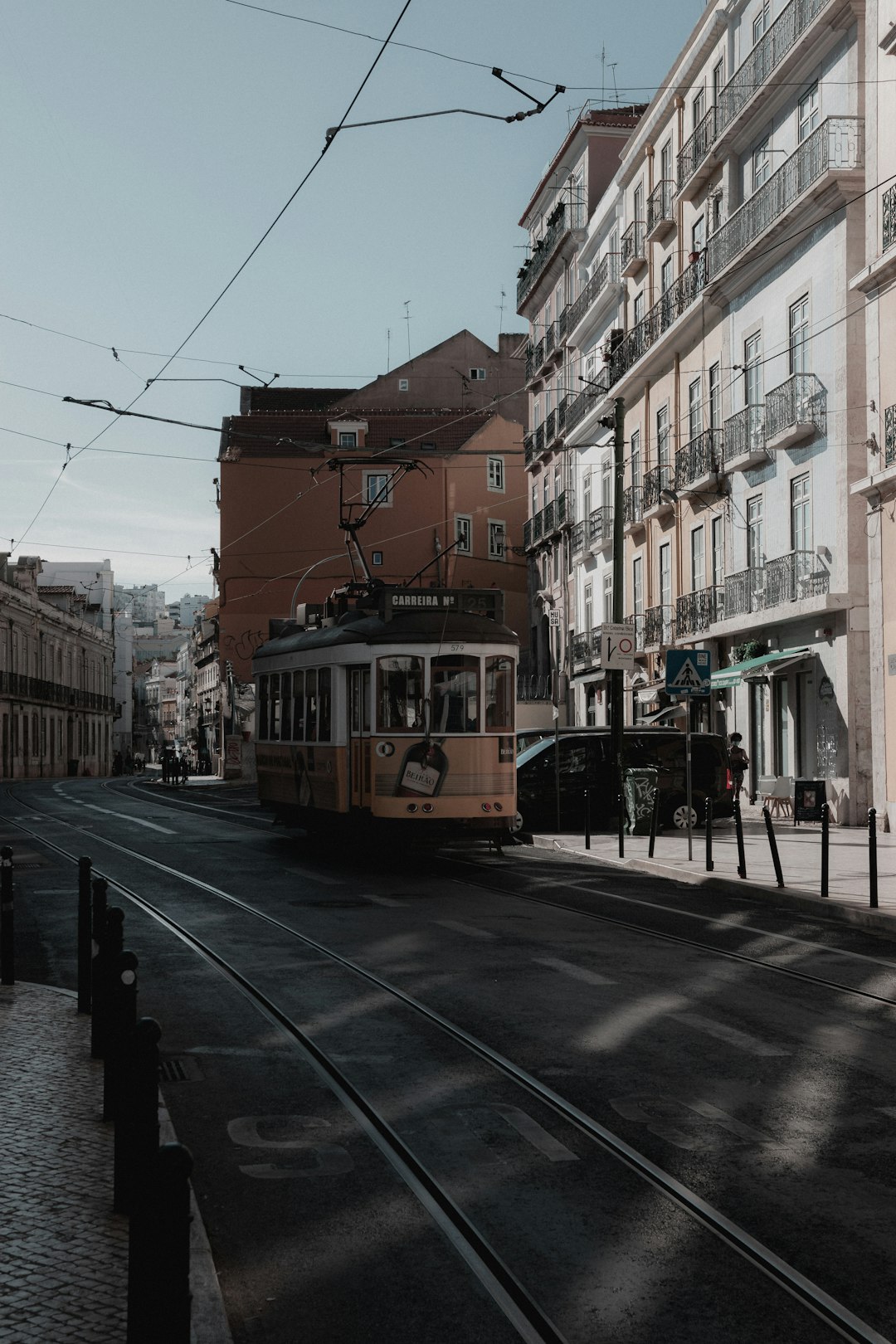 yellow tram on road during daytime