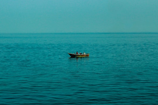 brown boat on sea during daytime in Qishm Iran