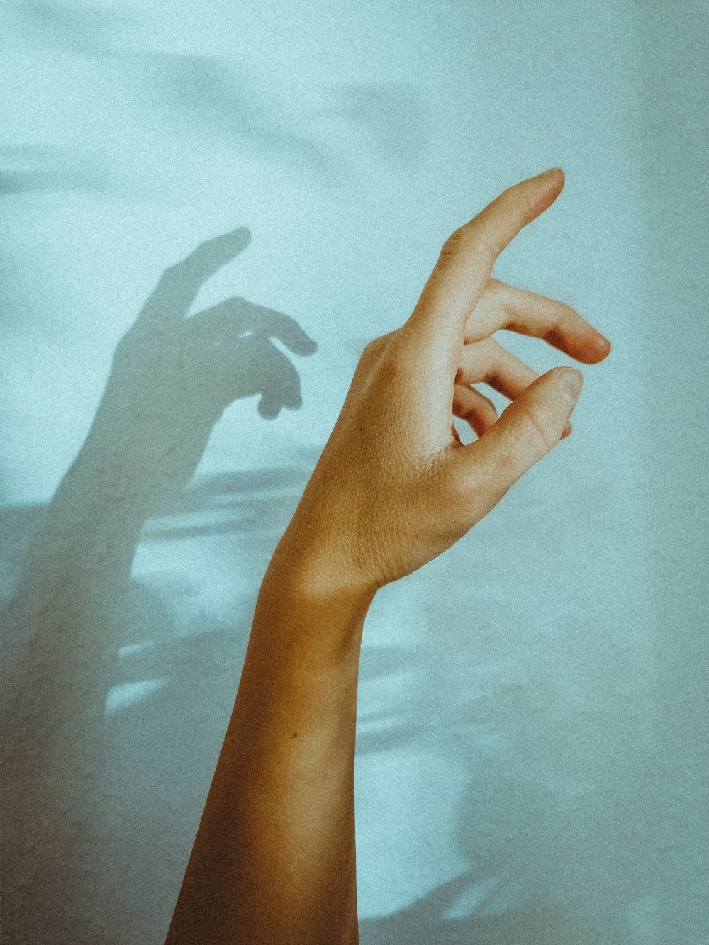 persons left hand on white textile