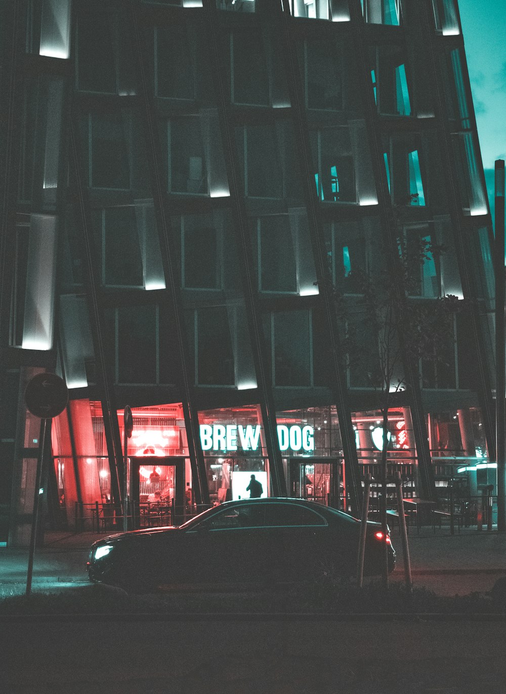 black car parked near red chairs