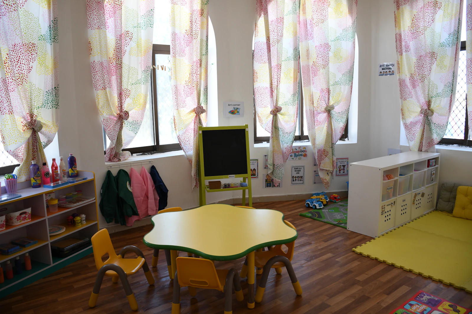 A diverse group of young children sitting together at a classroom table working on an activity