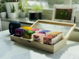 brown wooden box with assorted color pencils