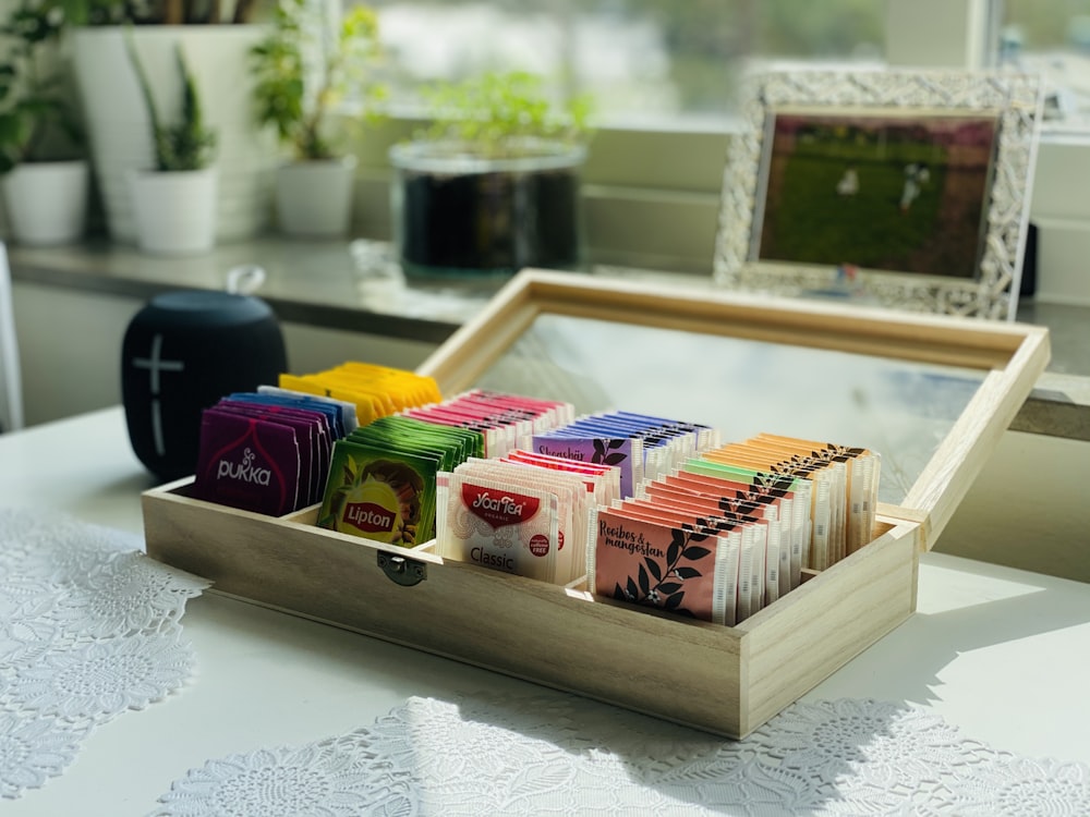 brown wooden box with assorted color pencils