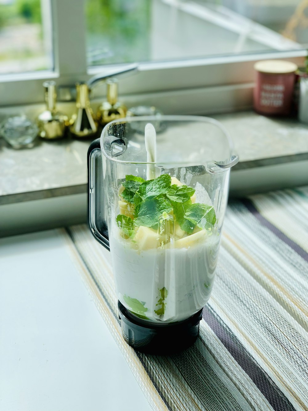 clear glass mug with white liquid