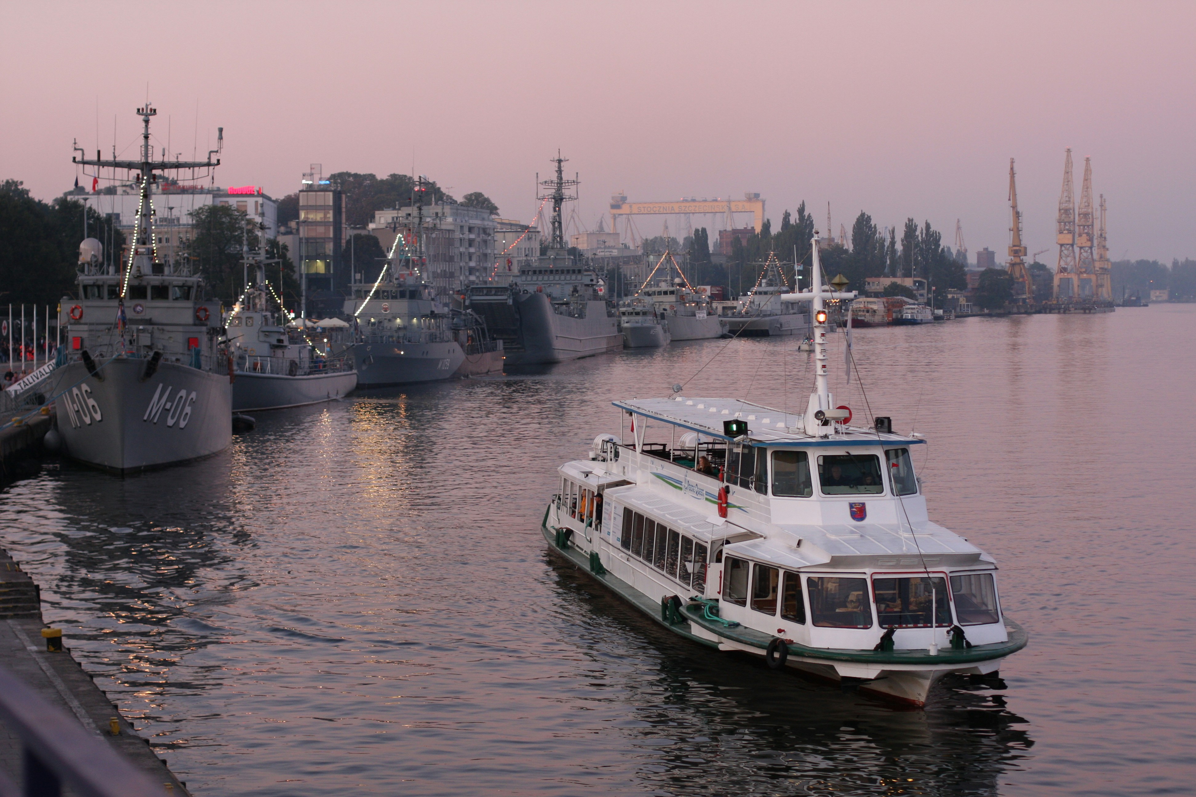 white and blue boat on water during daytime