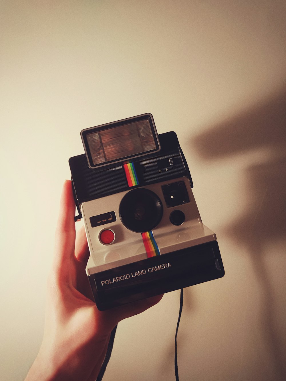 white and black polaroid instant camera