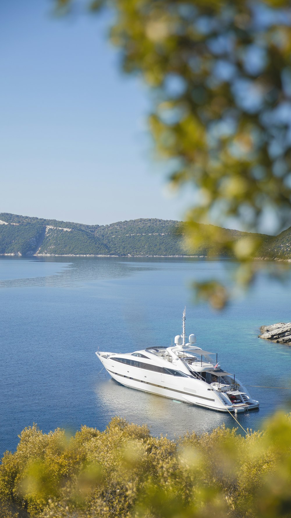 white boat on blue sea during daytime