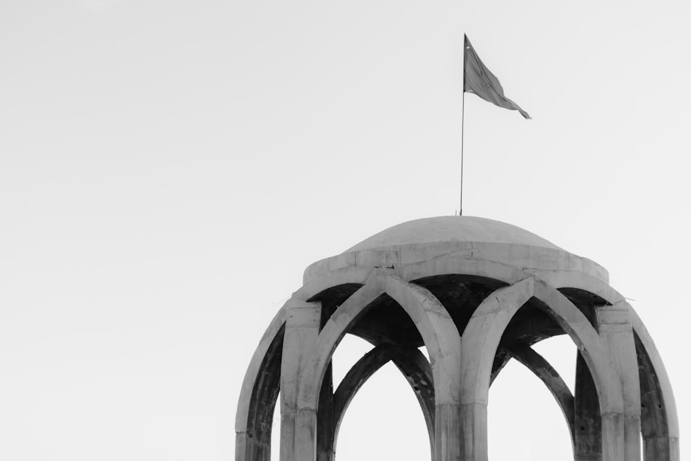 a black and white photo of a clock tower