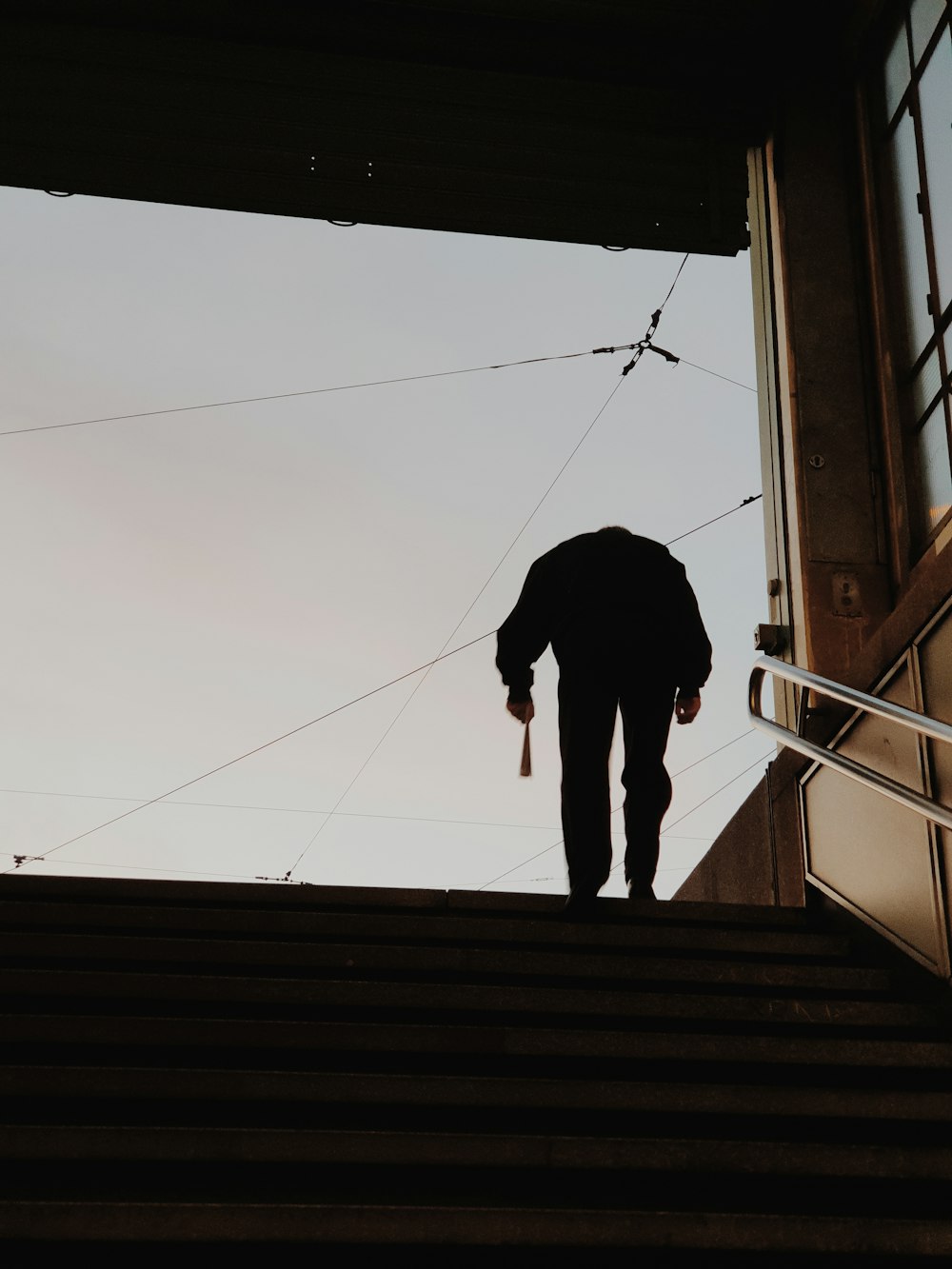 silhouette of person standing on the window