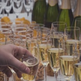 person holding clear drinking glass