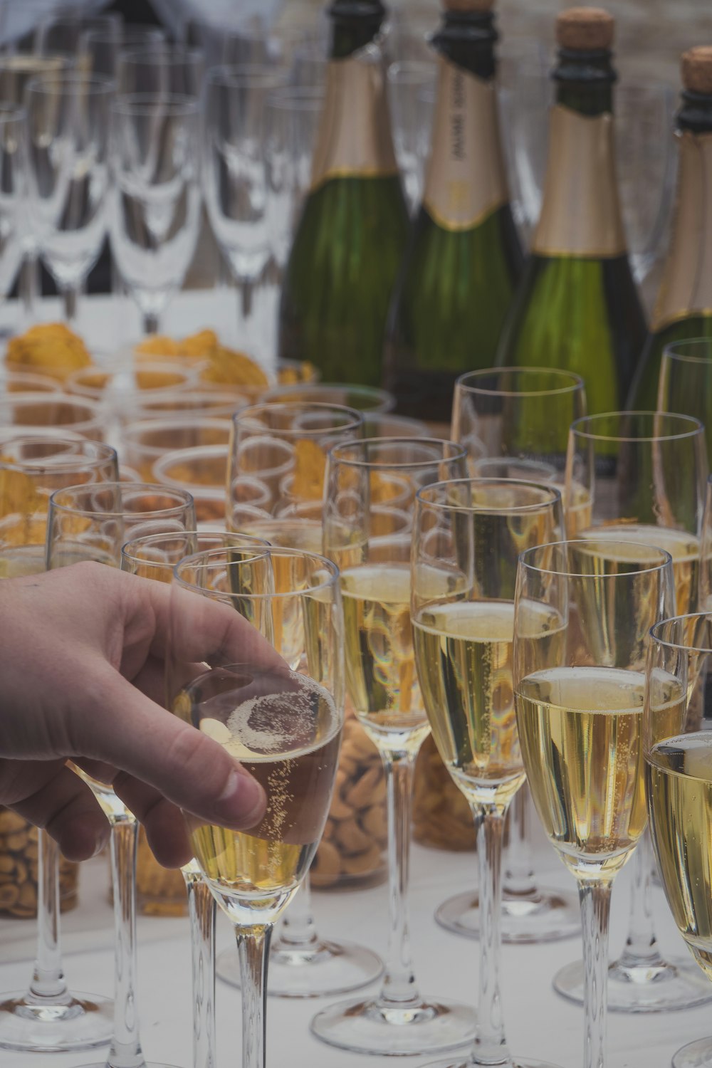 person holding clear drinking glass