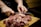 Close-up of hands expertly slicing premium cuts of meat at Maison Canu.