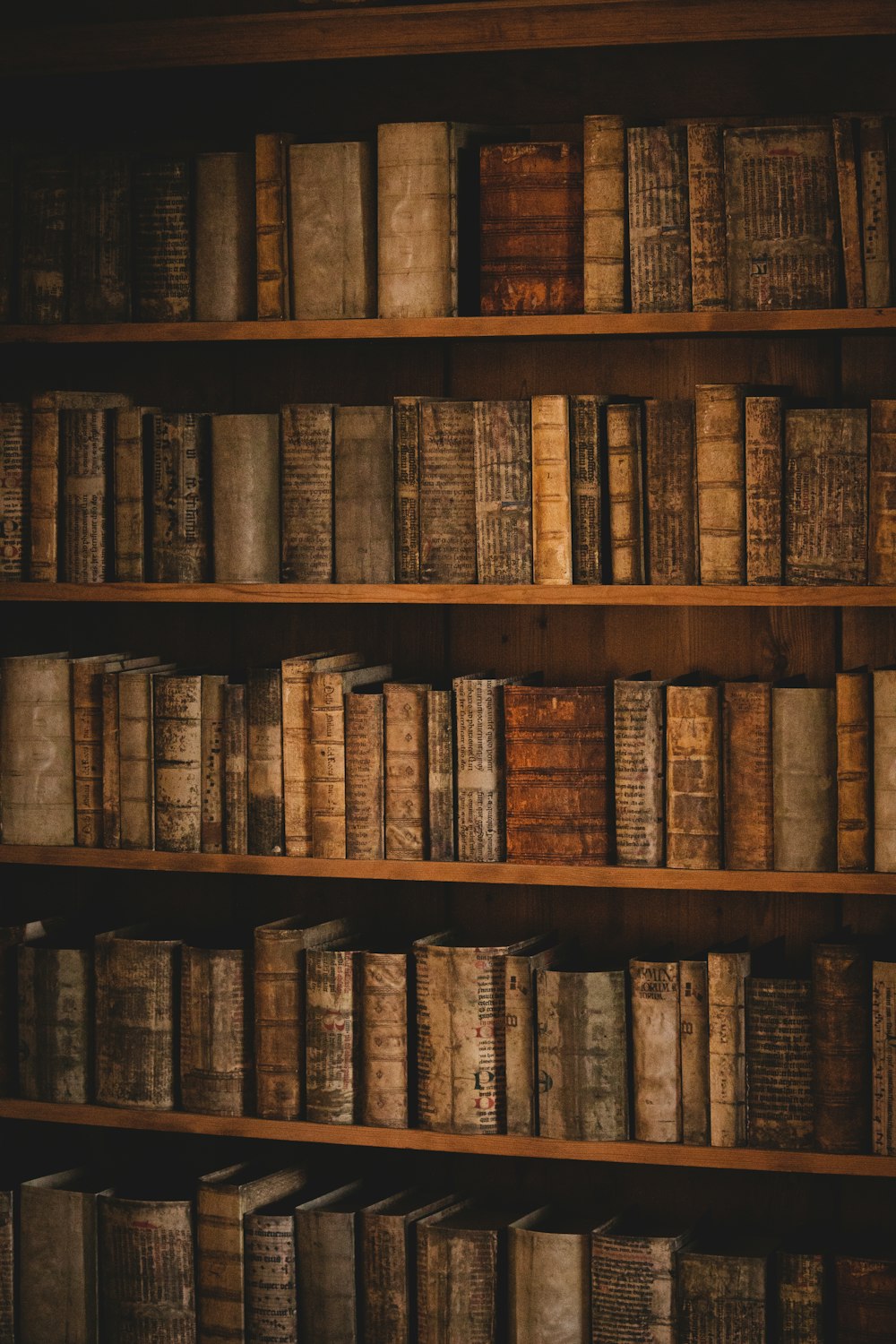 brown wooden book shelf with books