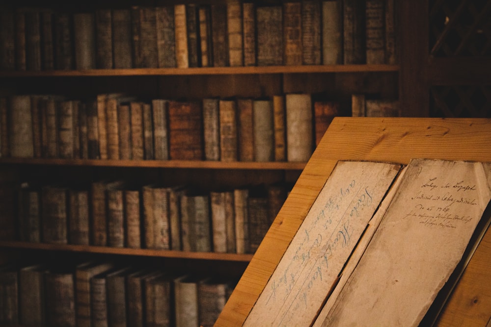 brown wooden book shelf with books