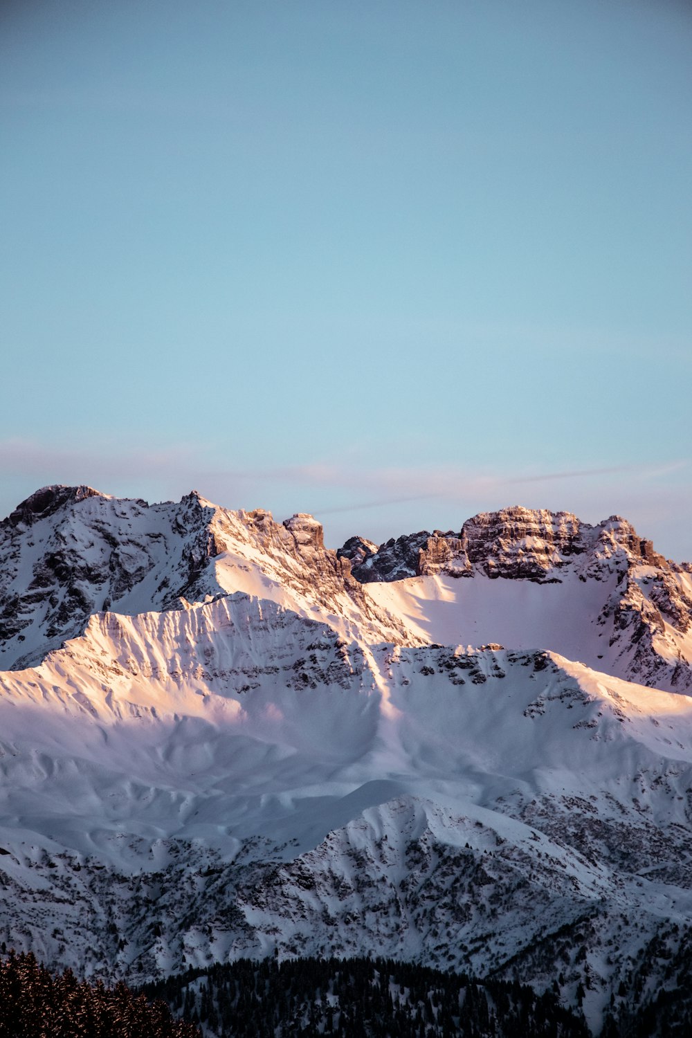 snow covered mountain under blue sky during daytime