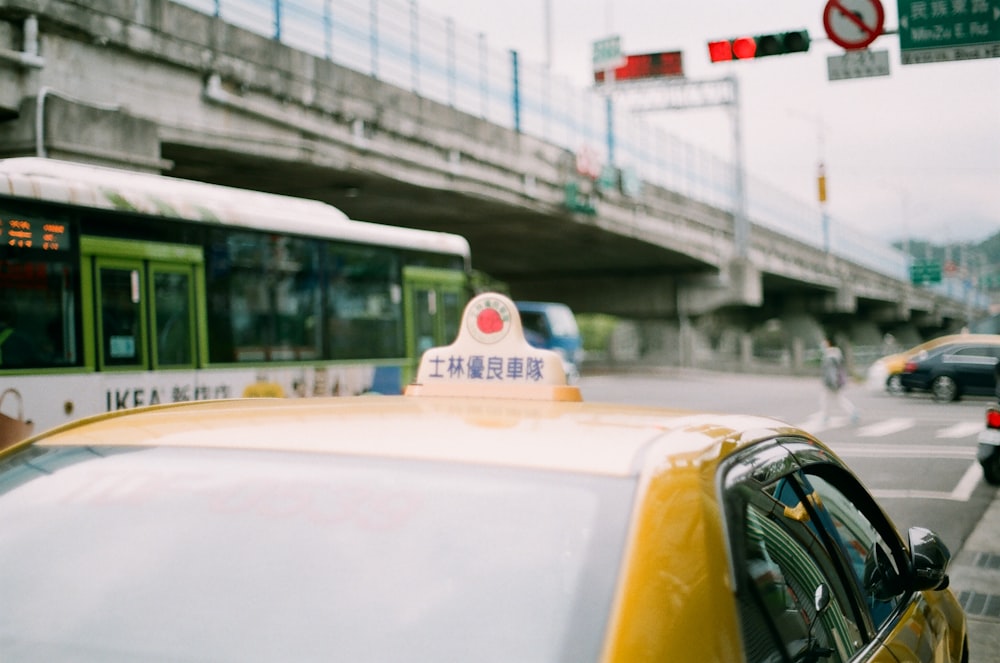 yellow taxi cab on road during daytime