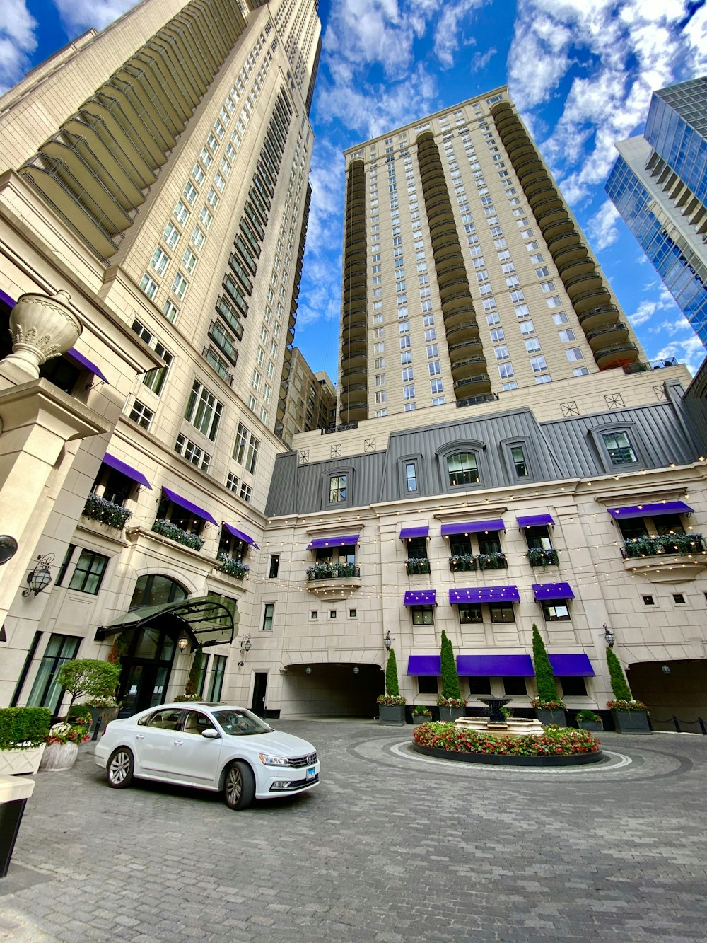 white suv parked beside building during daytime