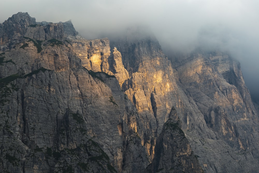 brown rocky mountain under white sky during daytime