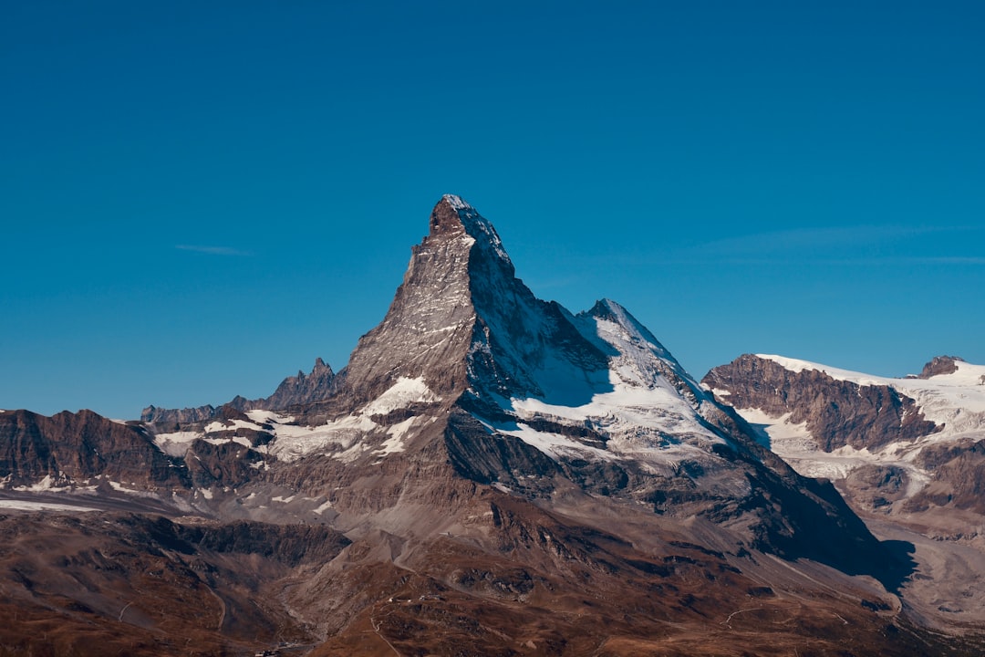 snow covered mountain under blue sky during daytime