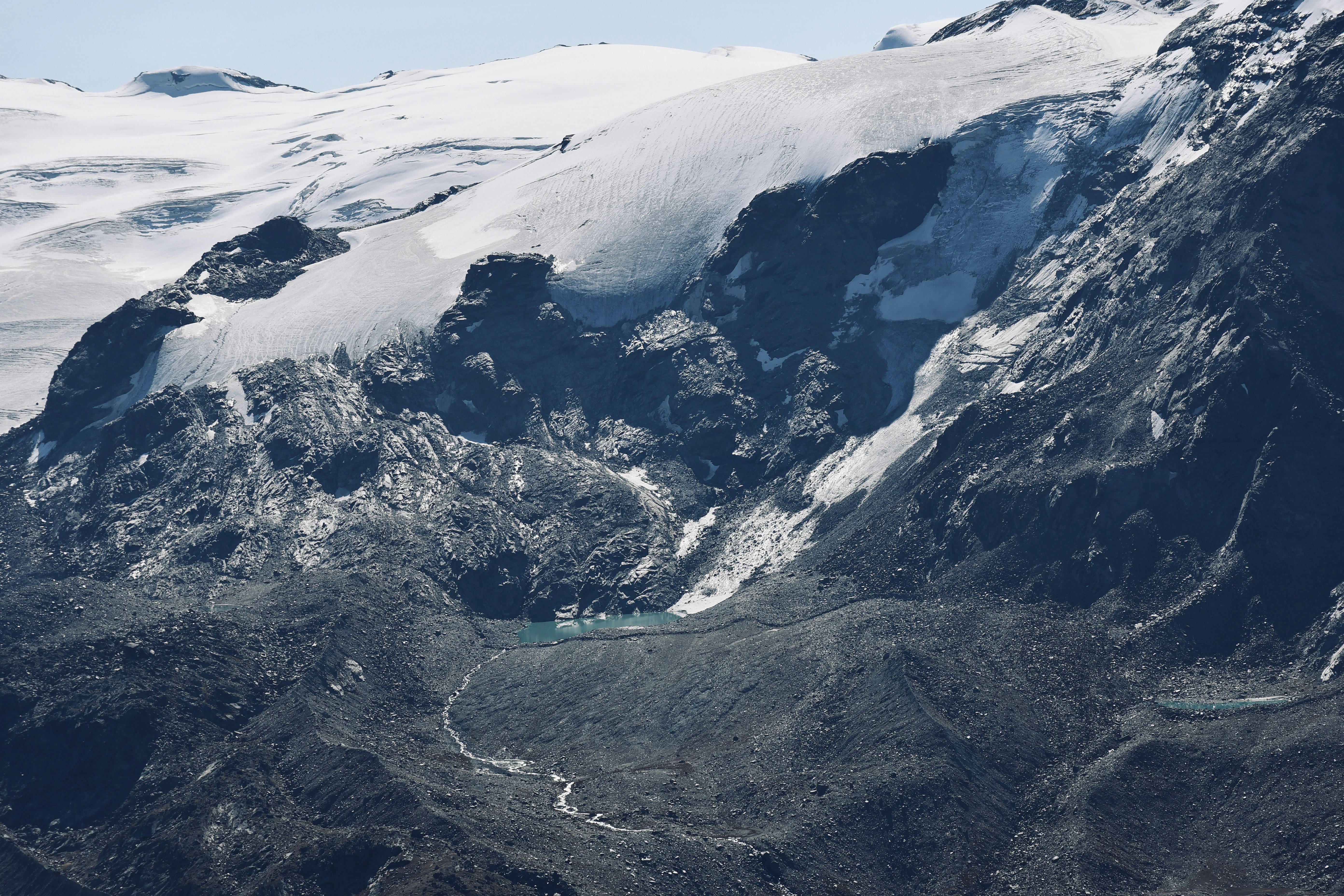 snow covered mountain during daytime