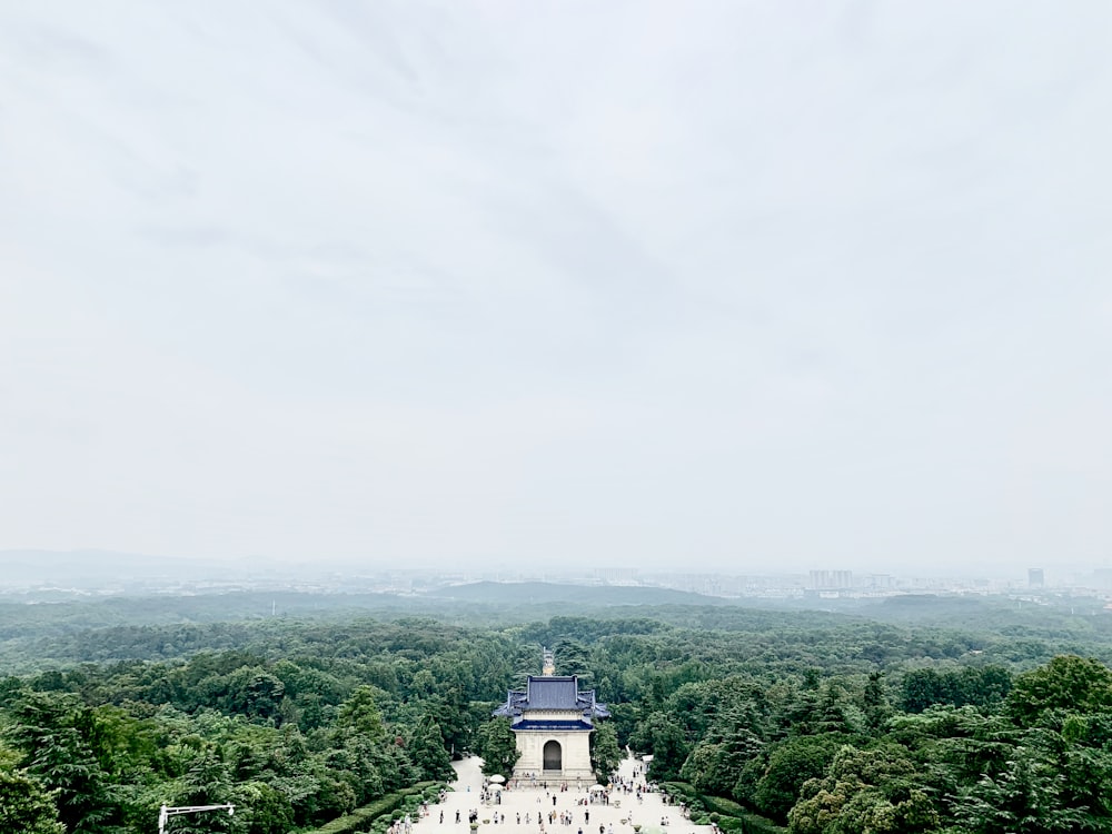 white concrete building on top of mountain