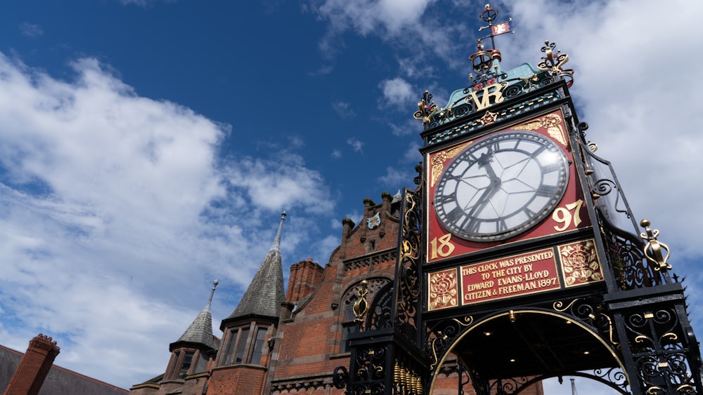 brown and white clock tower under blue sky during daytime