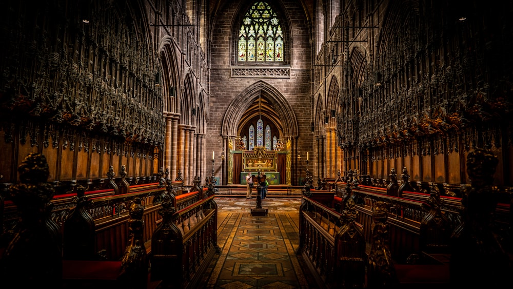 brown wooden bench inside cathedral