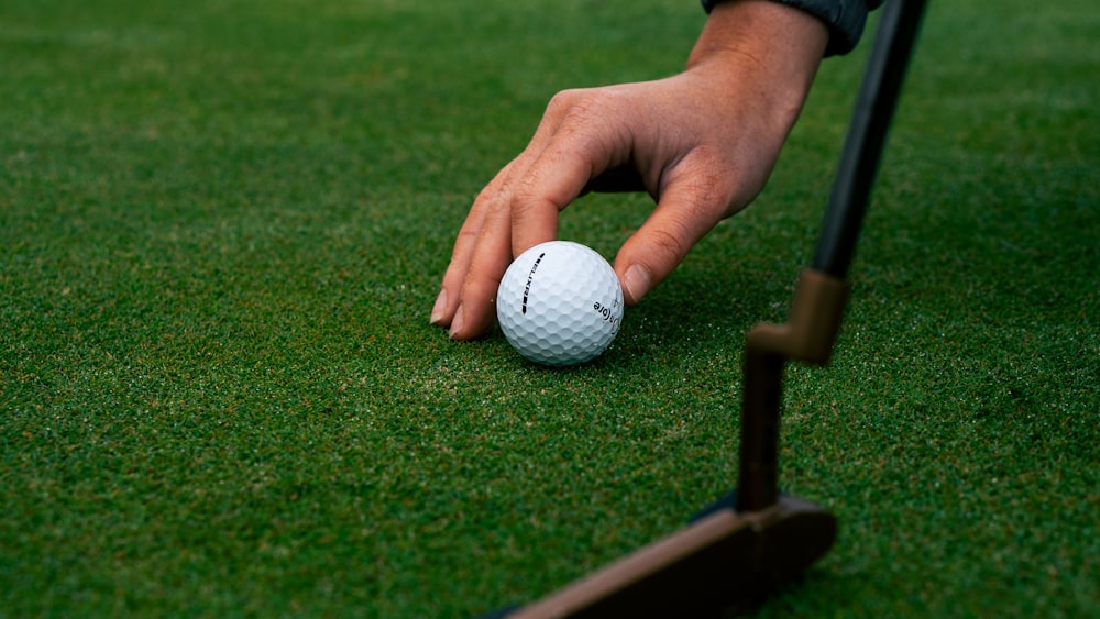 white golf ball on green grass field